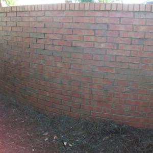 Graffiti Removal on community brick wall